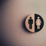 A black and white gendered toilet sign