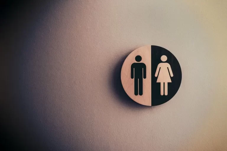 A black and white gendered toilet sign