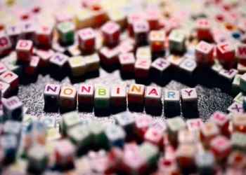 some colourful square beads which denote the gender 'non-binary'