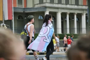 A person draped in a LGBTQ flag - gender as a social construct