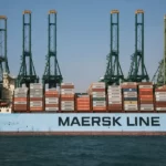A container ship transporting containers with the name 'maersk line' on the side