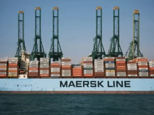 A container ship transporting containers with the name 'maersk line' on the side