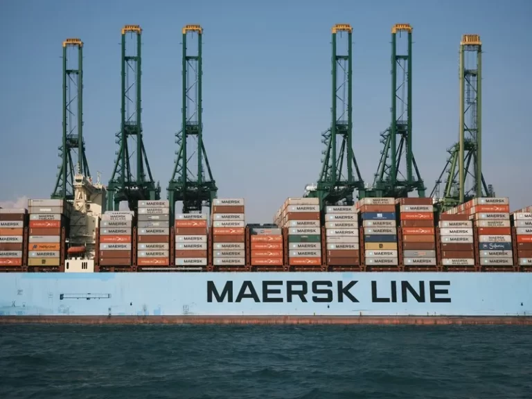 A container ship transporting containers with the name 'maersk line' on the side