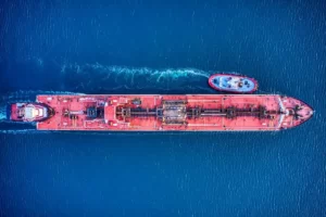 A container ship[ and tug boat viewed from above - globalisation