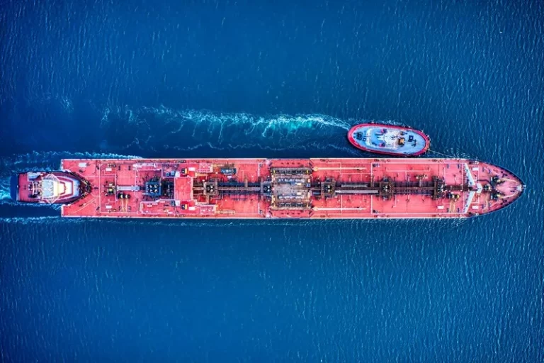 A container ship[ and tug boat viewed from above - globalisation
