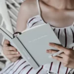 A woman looking at her life journal