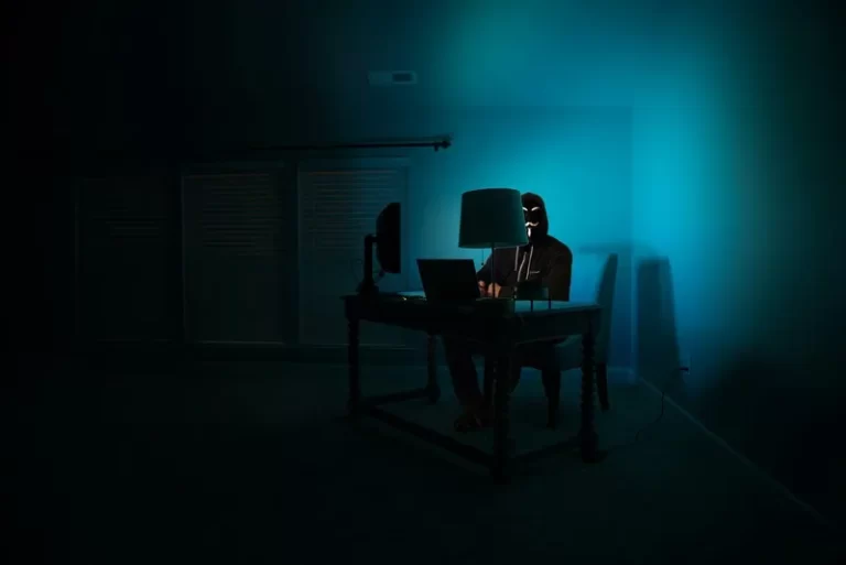 a person engaged in online activism in a dark room