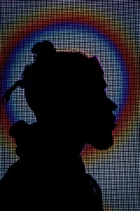 A silhoutted person in profile head shot individualisation