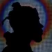 A silhoutted person in profile head shot individualisation