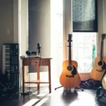 a collection of instruments in a shaded room