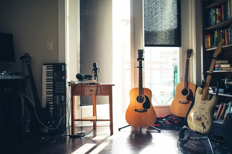 a collection of instruments in a shaded room