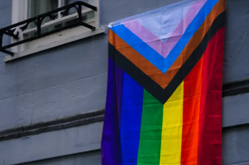 LGBT flag hanging from a window
