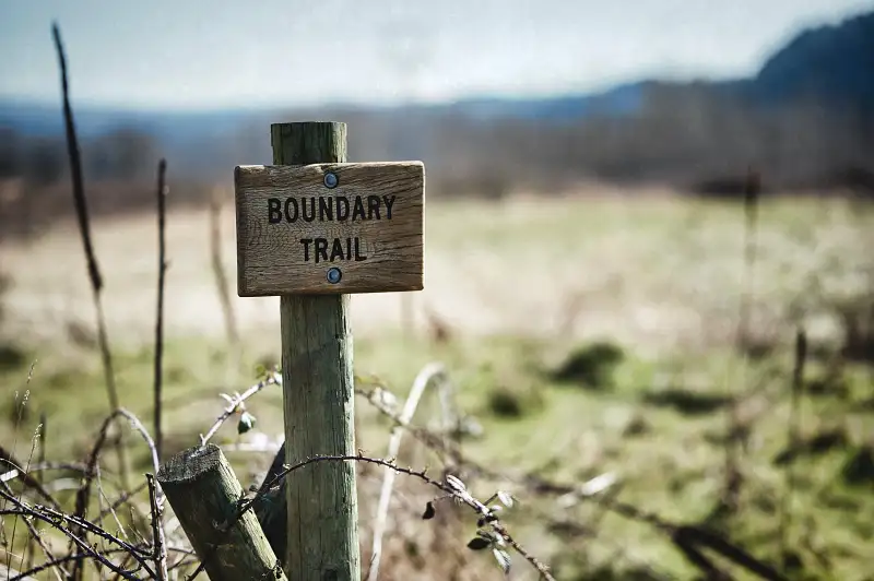 a boundary post in a field