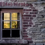 a window with surrounding brick work that doesnt match the building - dysfunction