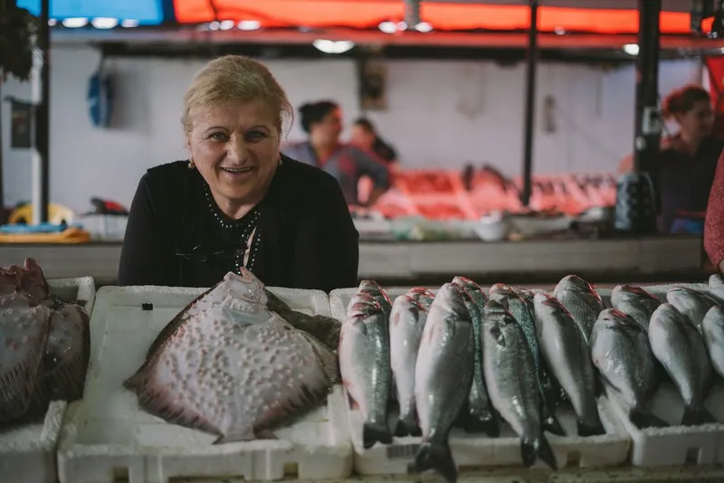 A market trading career with a man running a fish market stall