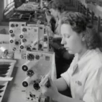 Women assembling technology items in the 1950's using the forces of production