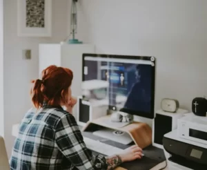 A woman using a computer performing labour labor work