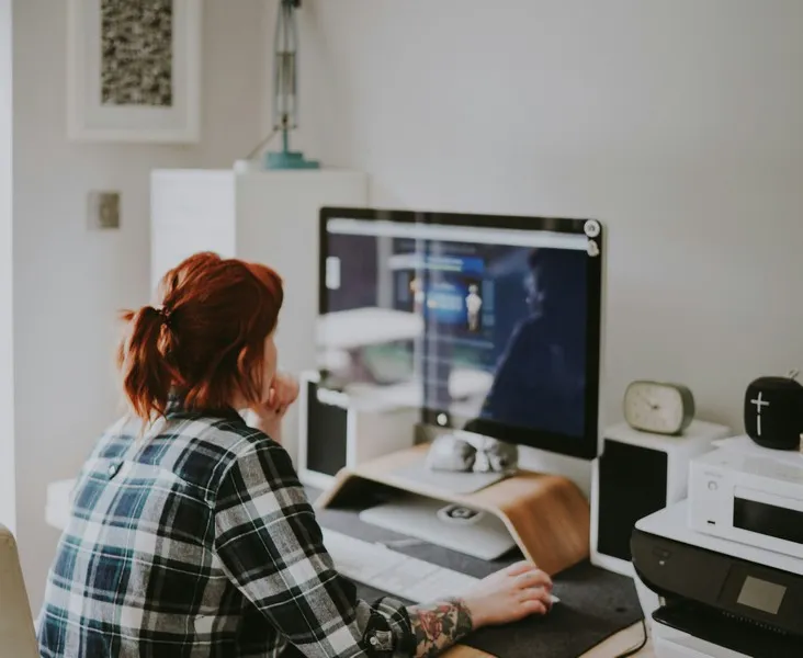 A woman using a computer performing labour labor work