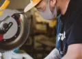 A man operating a cutting machine