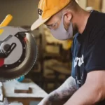A man operating a cutting machine