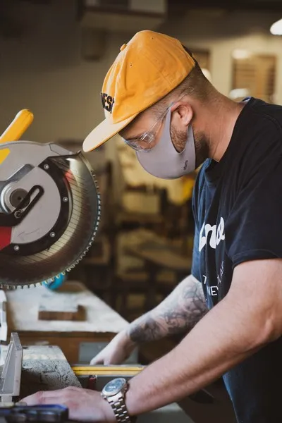 A man operating a cutting machine