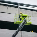 A man on a cherry picker