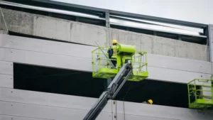 A man on a cherry picker
