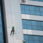 People washing windows on a skyscraper