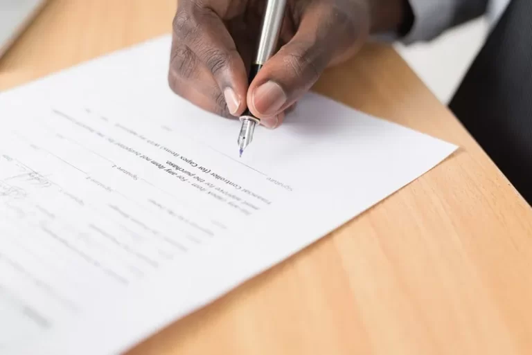 A person writing a document - post office