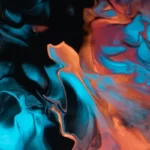 an abstract image of liquid in hues of oranges and blues