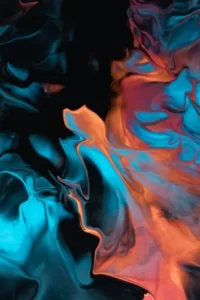 an abstract image of liquid in hues of oranges and blues
