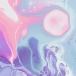 an abstract image of pink and blue swirls in pastel shades
