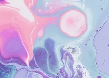 an abstract image of pink and blue swirls in pastel shades