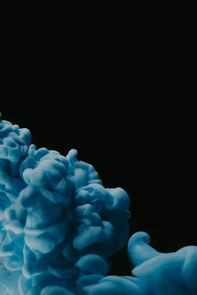 An ominous blue cloud against a black background