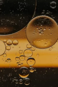 Abstract liquid bubbles in golden waters