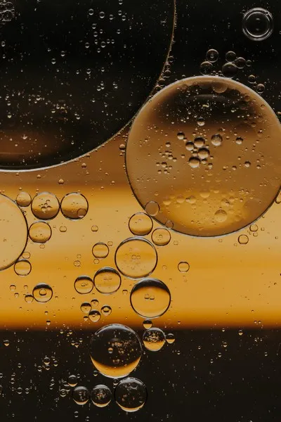 Abstract liquid bubbles in golden waters