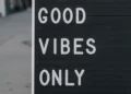 A street sign stating 'good vibes only' - social solidarity