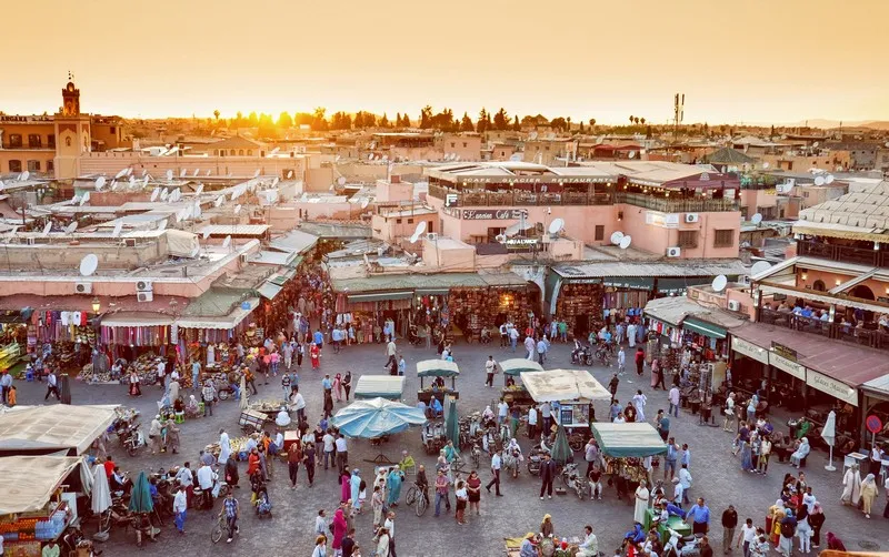 An overhead shot of a market place at sunset.
