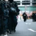 A line of riot police in the street