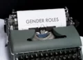 A typewriter displaying the words 'gender roles'