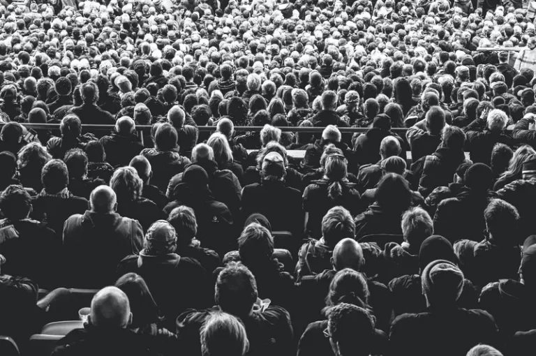 black and white image of a crowd from the back