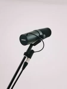 A microphone against a grey background.