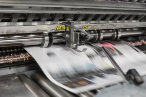 newspapers exiting the printing press