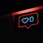 A neon likes button with zero likes
