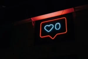 A neon likes button with zero likes