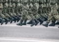 a view of the feet of soldiers on military parade