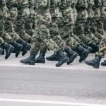 a view of the feet of soldiers on military parade