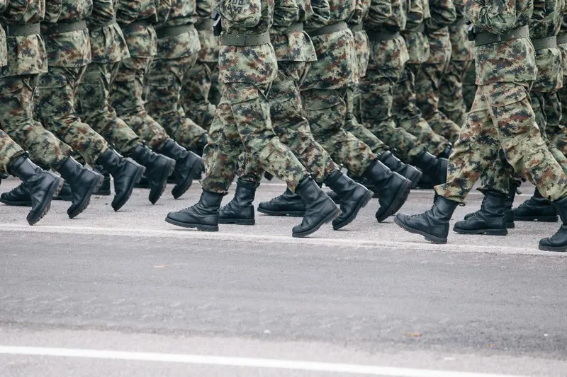 a view of the feet of soldiers on military parade