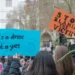 protest placards stating anti-misogyny slogans