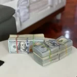 2 bundles of US dollars in rubber bands - economic capital